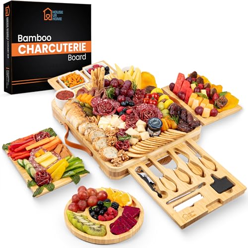 Large bamboo charcuterie board gift set with 4 hidden drawers, extensive accessories, and an elaborate food display.